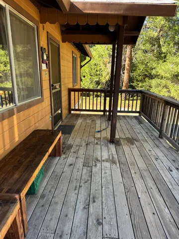 a view of balcony with wooden floor