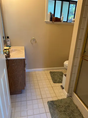 a bathroom with a sink and toilet