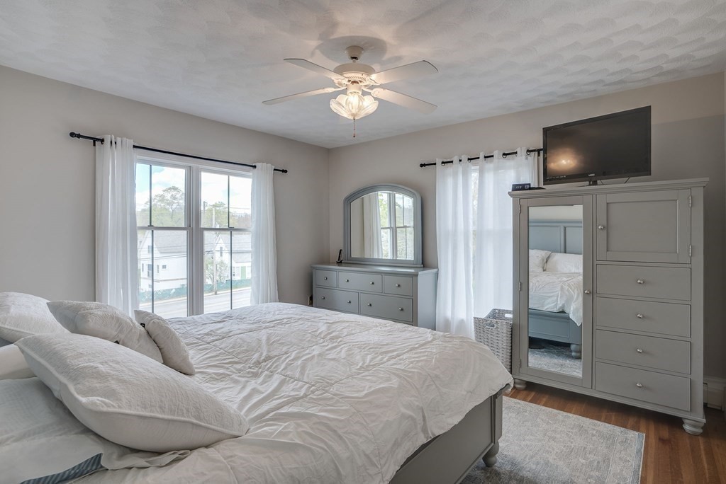 349 Boston Road Billerica, MA 01821 - Photo 17 of 41 a spacious bedroom with a large bed and a flat screen tv