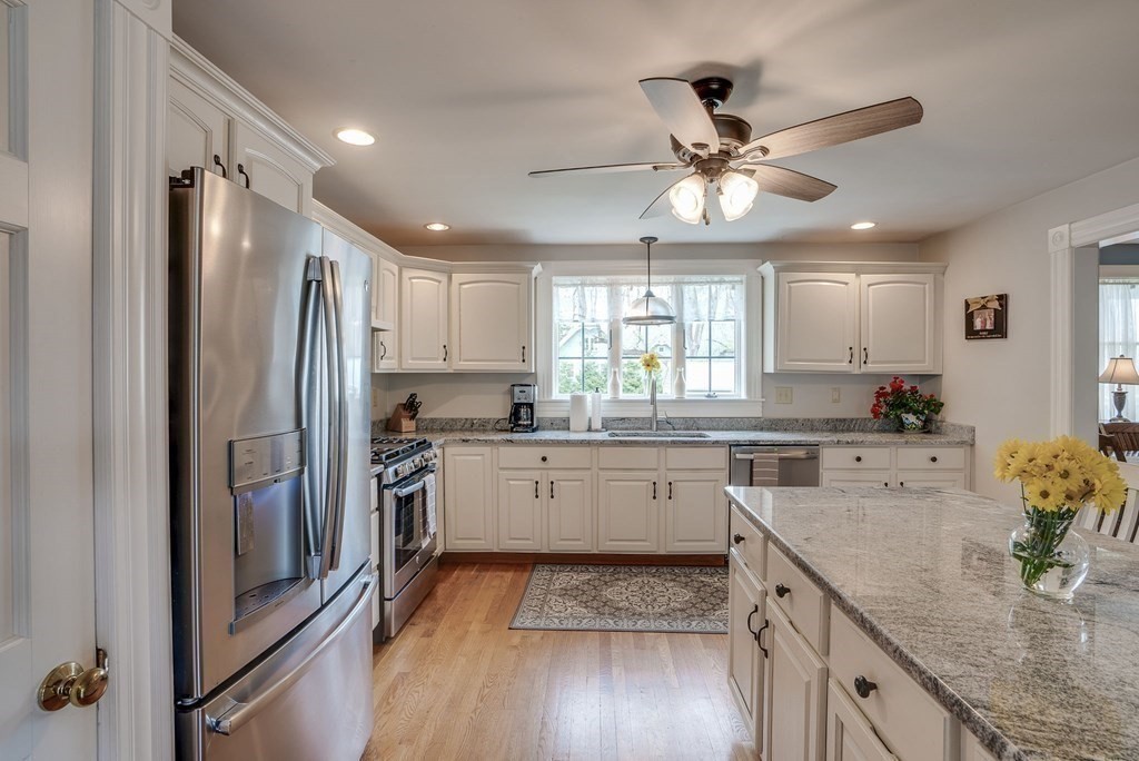 349 Boston Road Billerica, MA 01821 - Photo 3 of 41 a kitchen with a refrigerator sink and cabinets