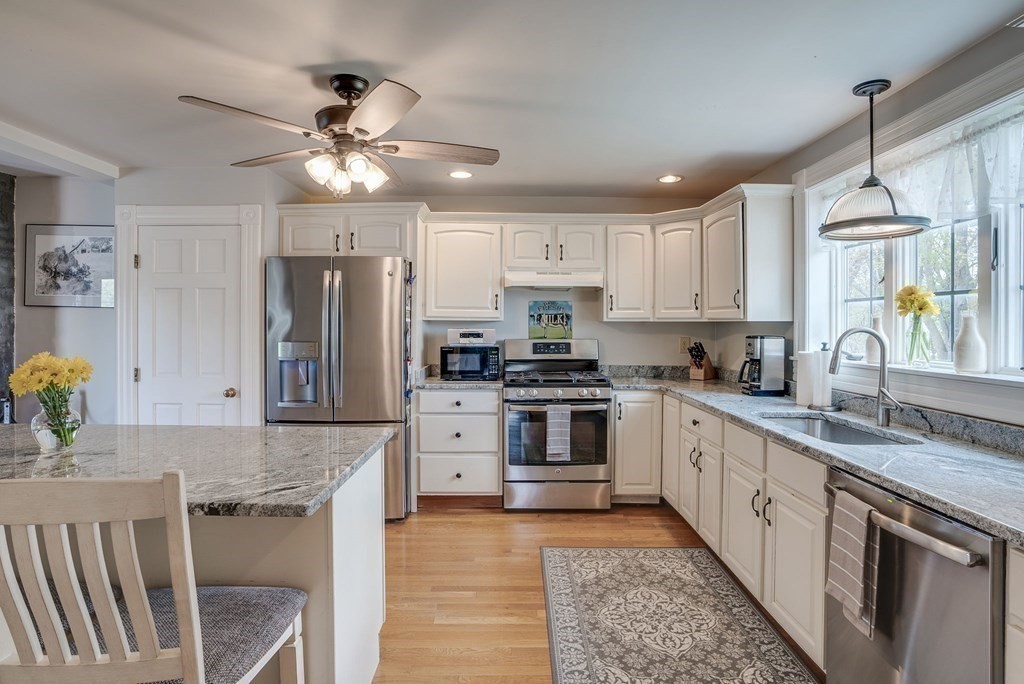 349 Boston Road Billerica, MA 01821 - Photo 4 of 41 a kitchen with stainless steel appliances granite countertop a stove refrigerator sink and microwave