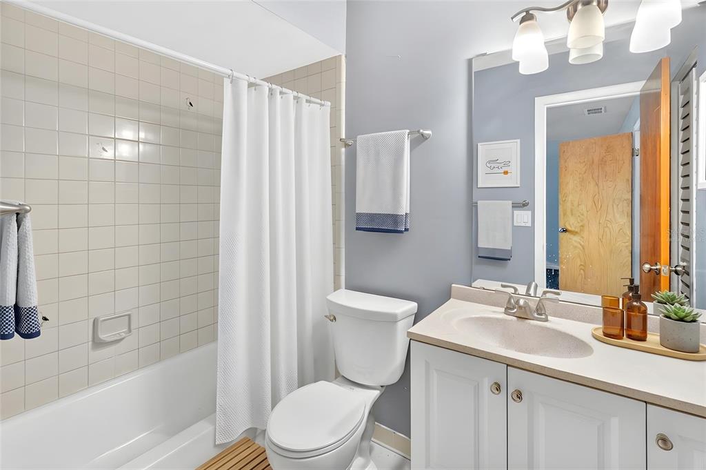 2941 Southwest 39th Avenue Gainesville, FL 32608 - Photo 19 of 39 a bathroom with a sink a toilet and shower