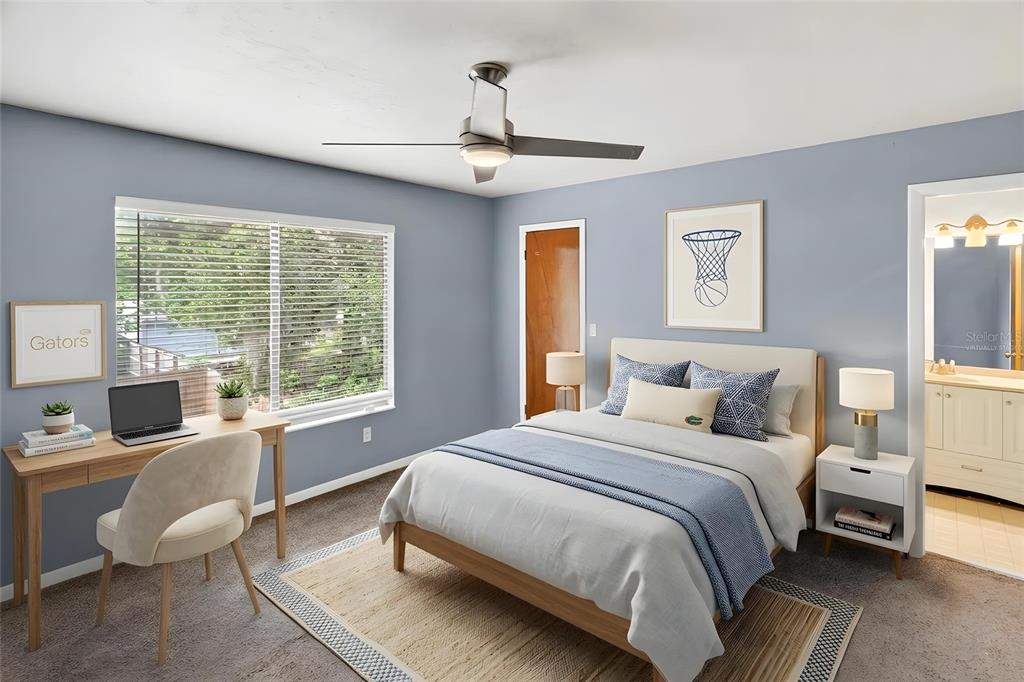 2941 Southwest 39th Avenue Gainesville, FL 32608 - Photo 23 of 39 a bedroom with a bed wooden floor and window