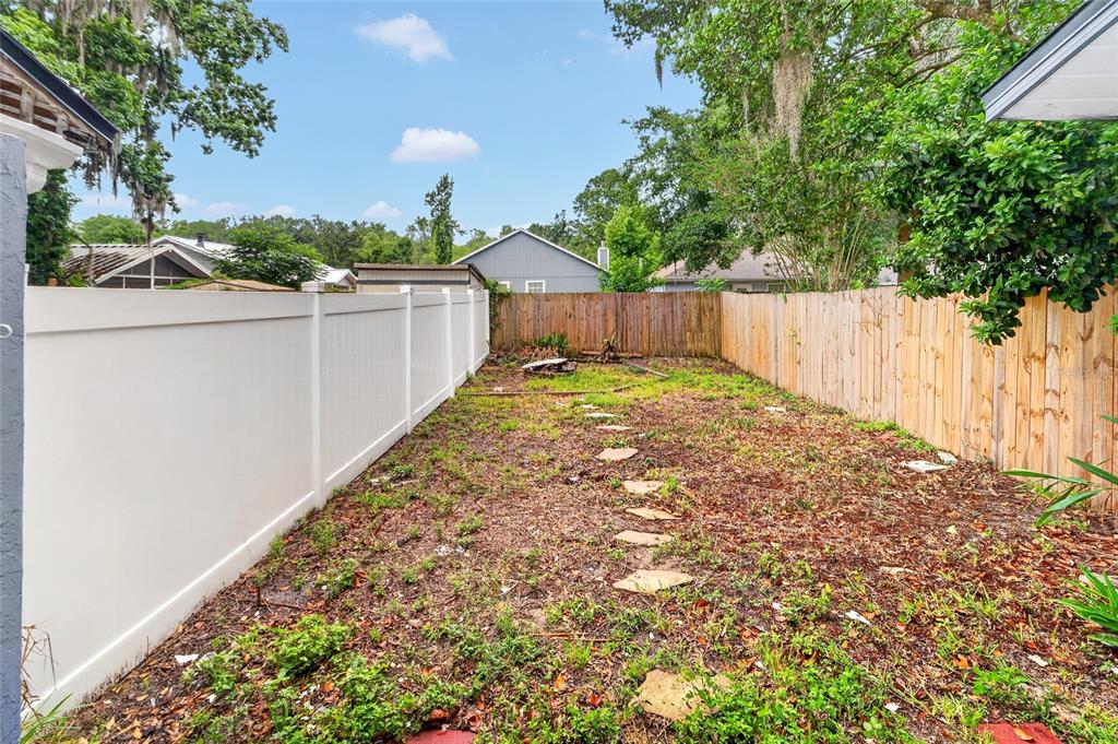 2941 Southwest 39th Avenue Gainesville, FL 32608 - Photo 34 of 39 a view of a backyard with pathway