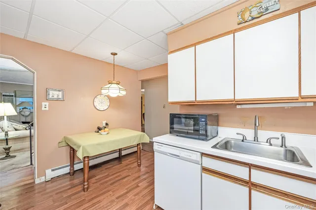 a view of a living room and kitchen