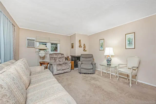 a living room with furniture and a lamp