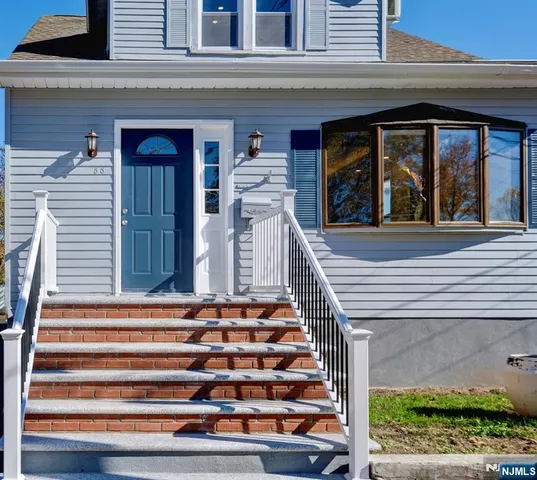 a front view of a house with a porch