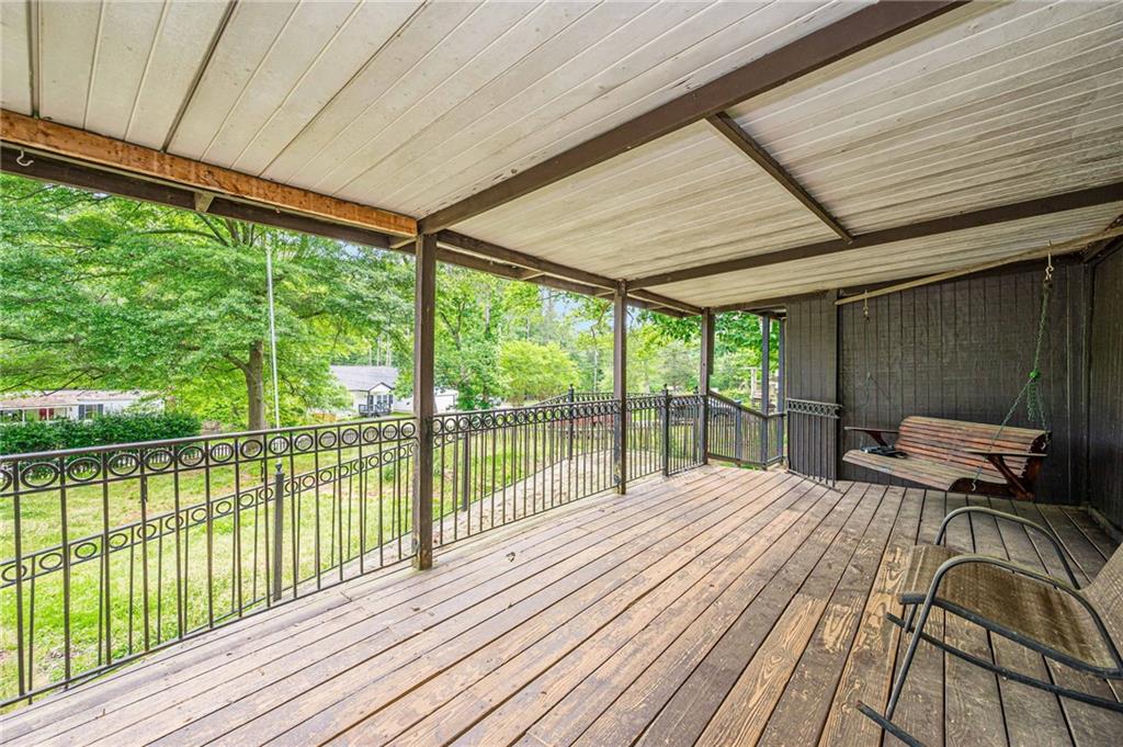 90 Valley Trail Southeast Acworth, GA 30101 - Photo 2 of 28 a bedroom with a bed and wooden floor