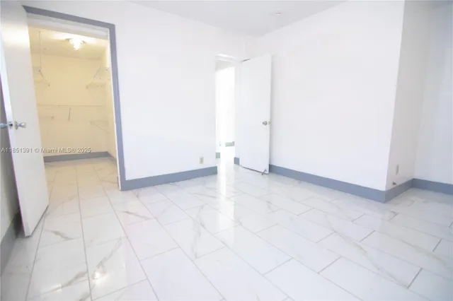 an empty room with a natural light