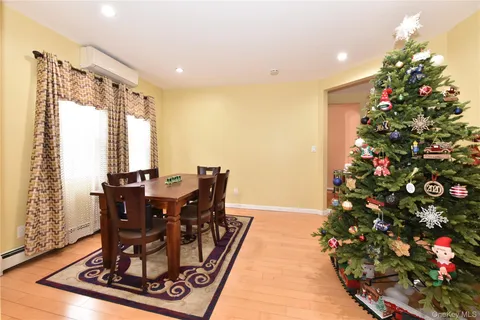 a view of a dining room with furniture and window