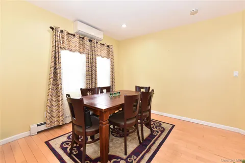 a view of a dining room with furniture and window