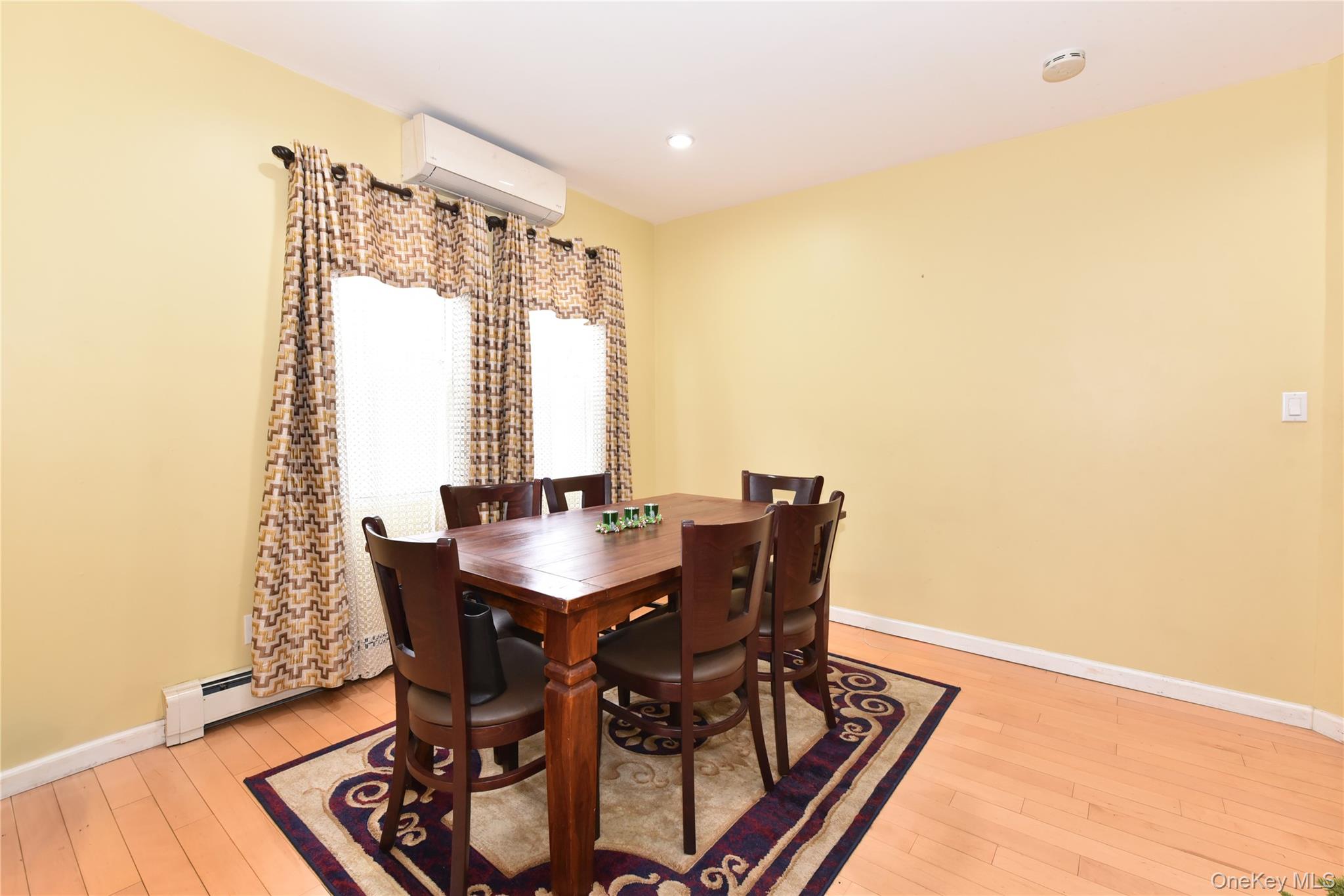 113 Stewart Avenue Hempstead, NY 11550 - Photo 16 of 30 a view of a dining room with furniture and window
