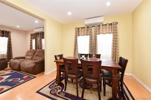 a view of a dining room with furniture and a window