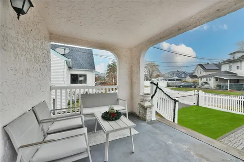 a living room with furniture and a garden
