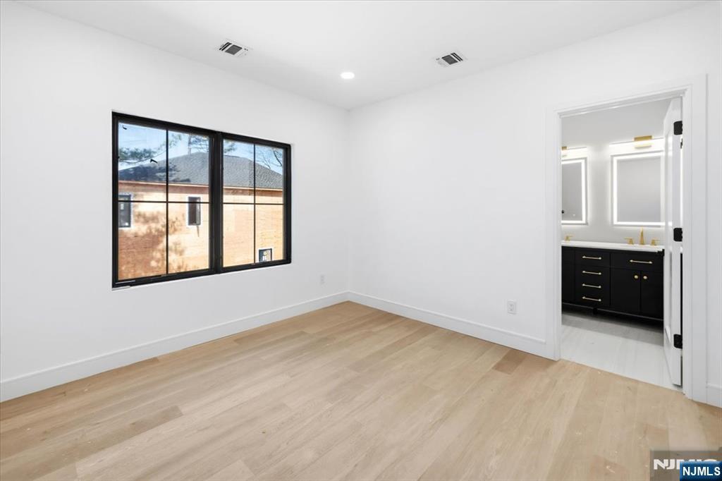 150 Howland Avenue River Edge, NJ 07661 - Photo 20 of 45 a view of an empty room with a window