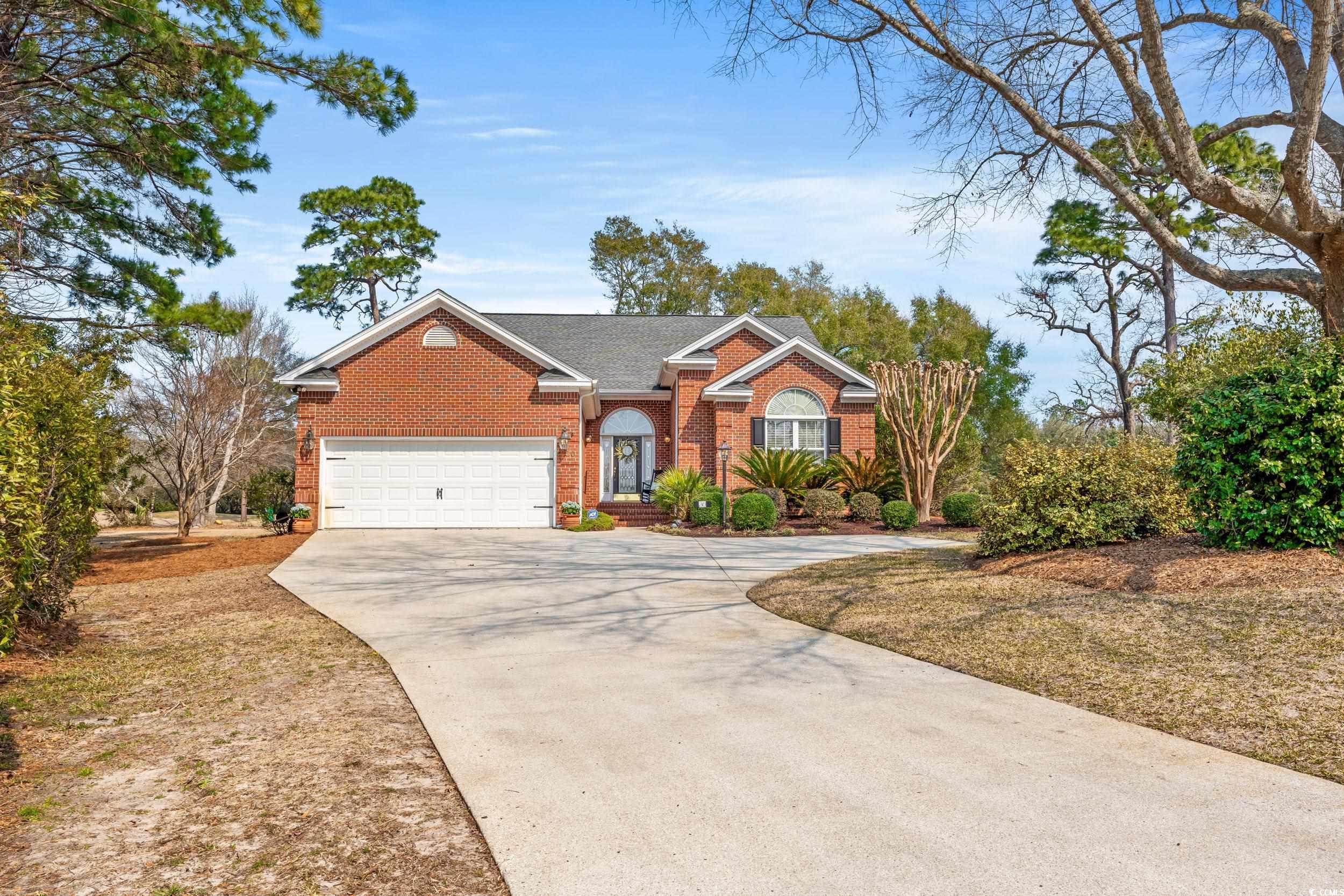 30 Baldwin Loop Pawleys Island, SC 29585 - Photo 1 of 39 View of front of property featuring concrete drive