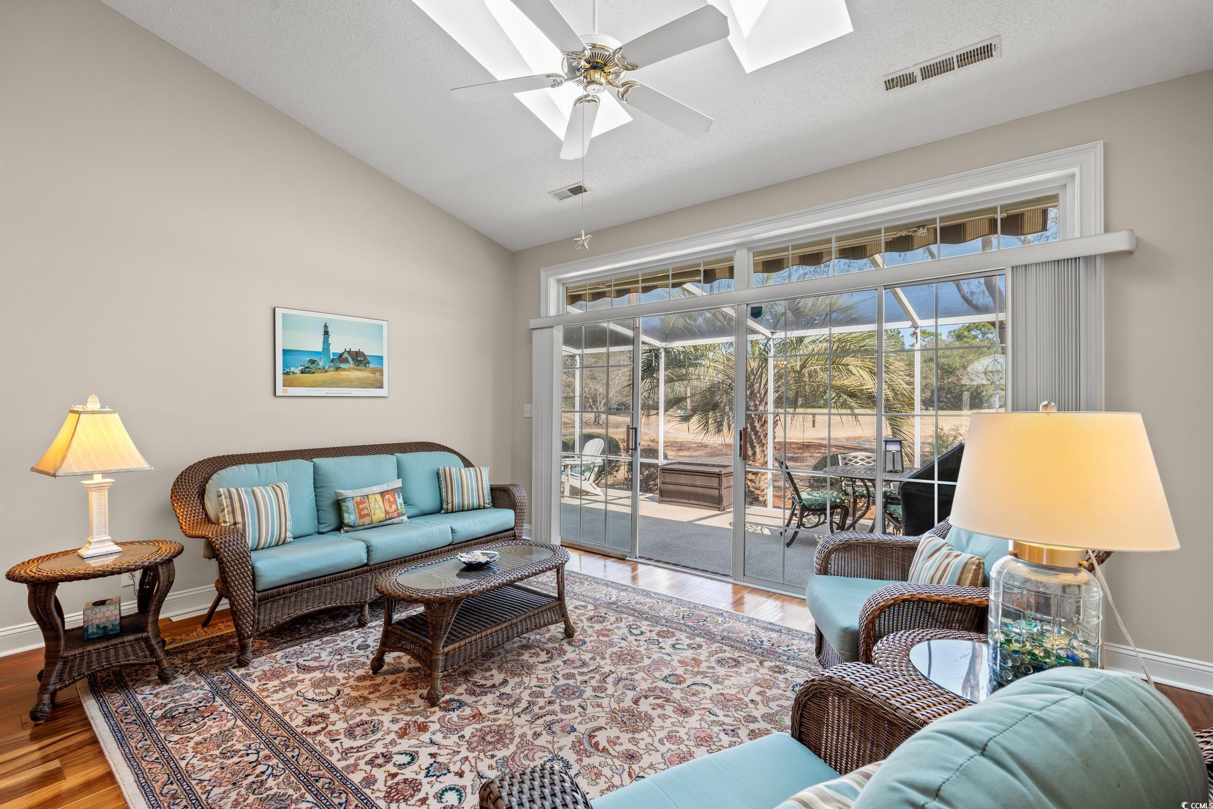 30 Baldwin Loop Pawleys Island, SC 29585 - Photo 18 of 39 Living room featuring ceiling fan, wood finished f