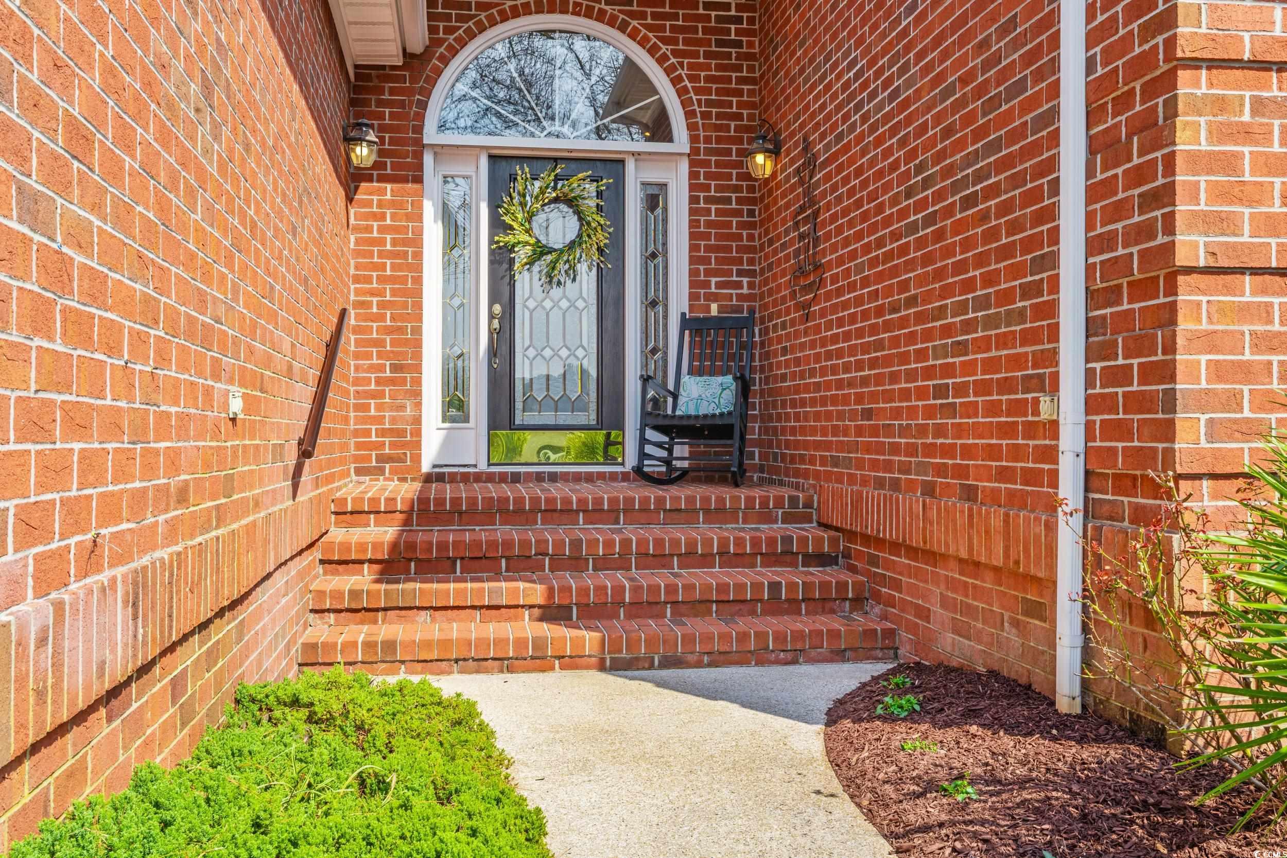 30 Baldwin Loop Pawleys Island, SC 29585 - Photo 2 of 39 Entrance to property featuring brick siding