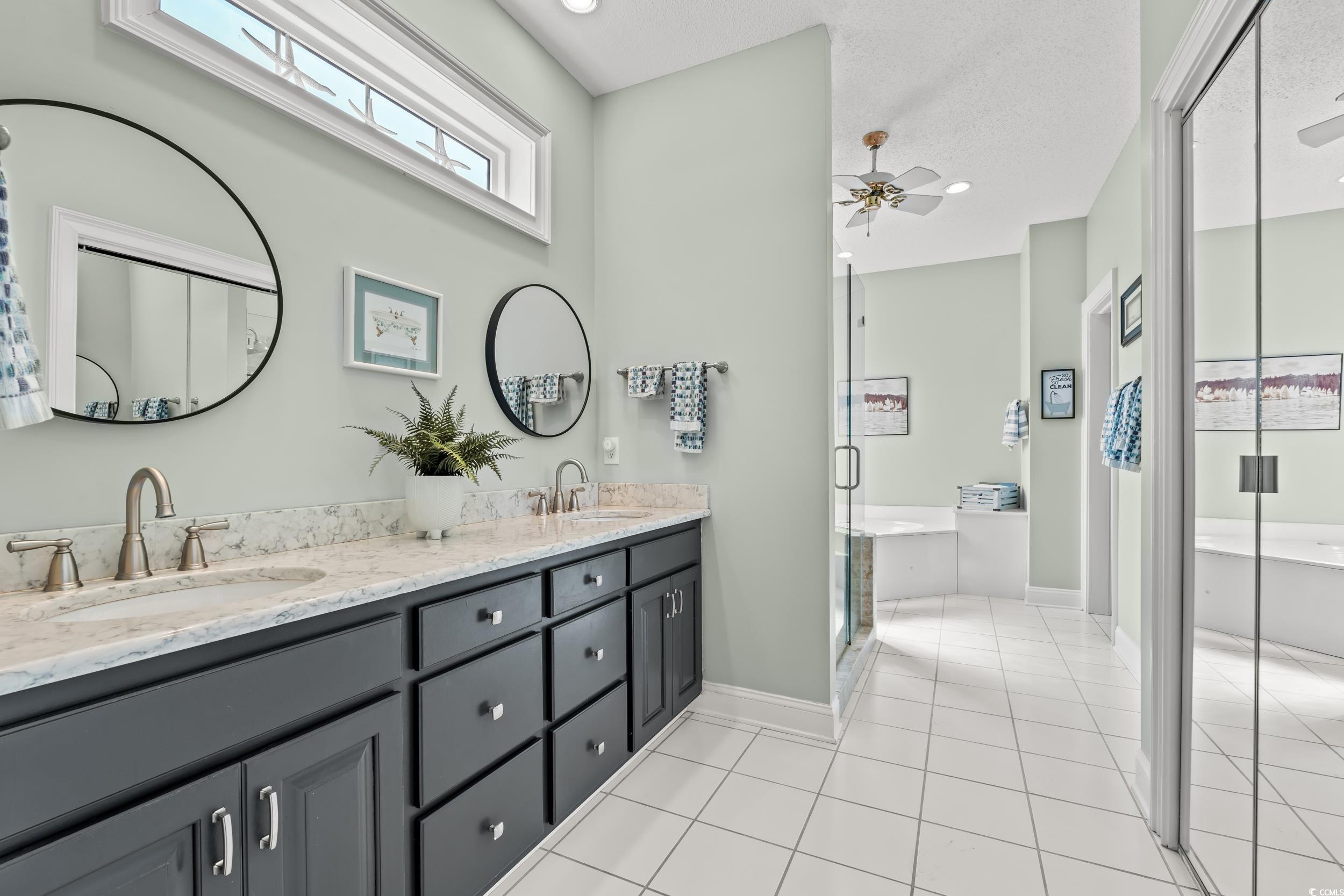 30 Baldwin Loop Pawleys Island, SC 29585 - Photo 25 of 39 Full bathroom with double vanity, a garden tub, ti