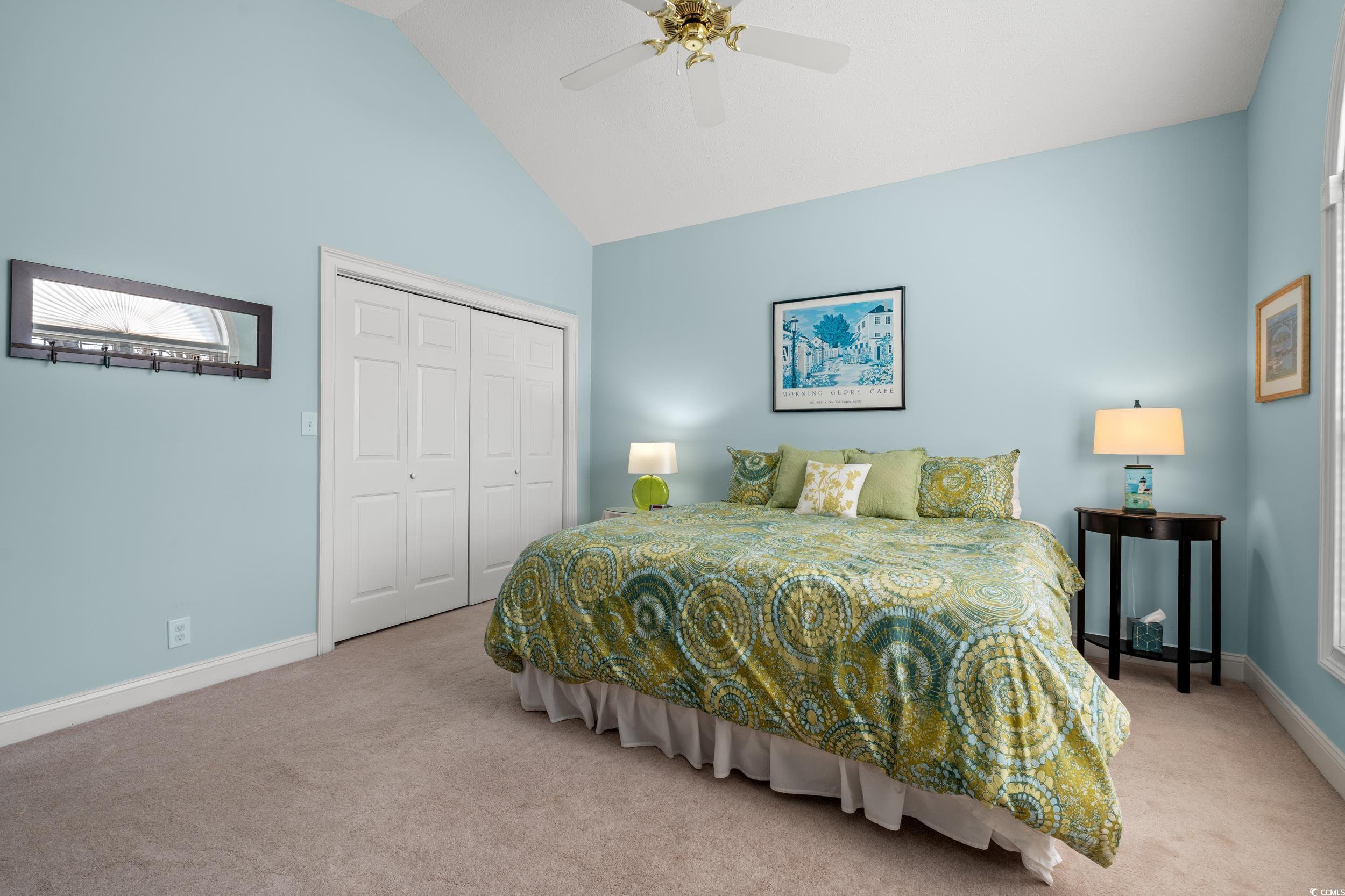 30 Baldwin Loop Pawleys Island, SC 29585 - Photo 27 of 39 Bedroom with light carpet, high vaulted ceiling, b