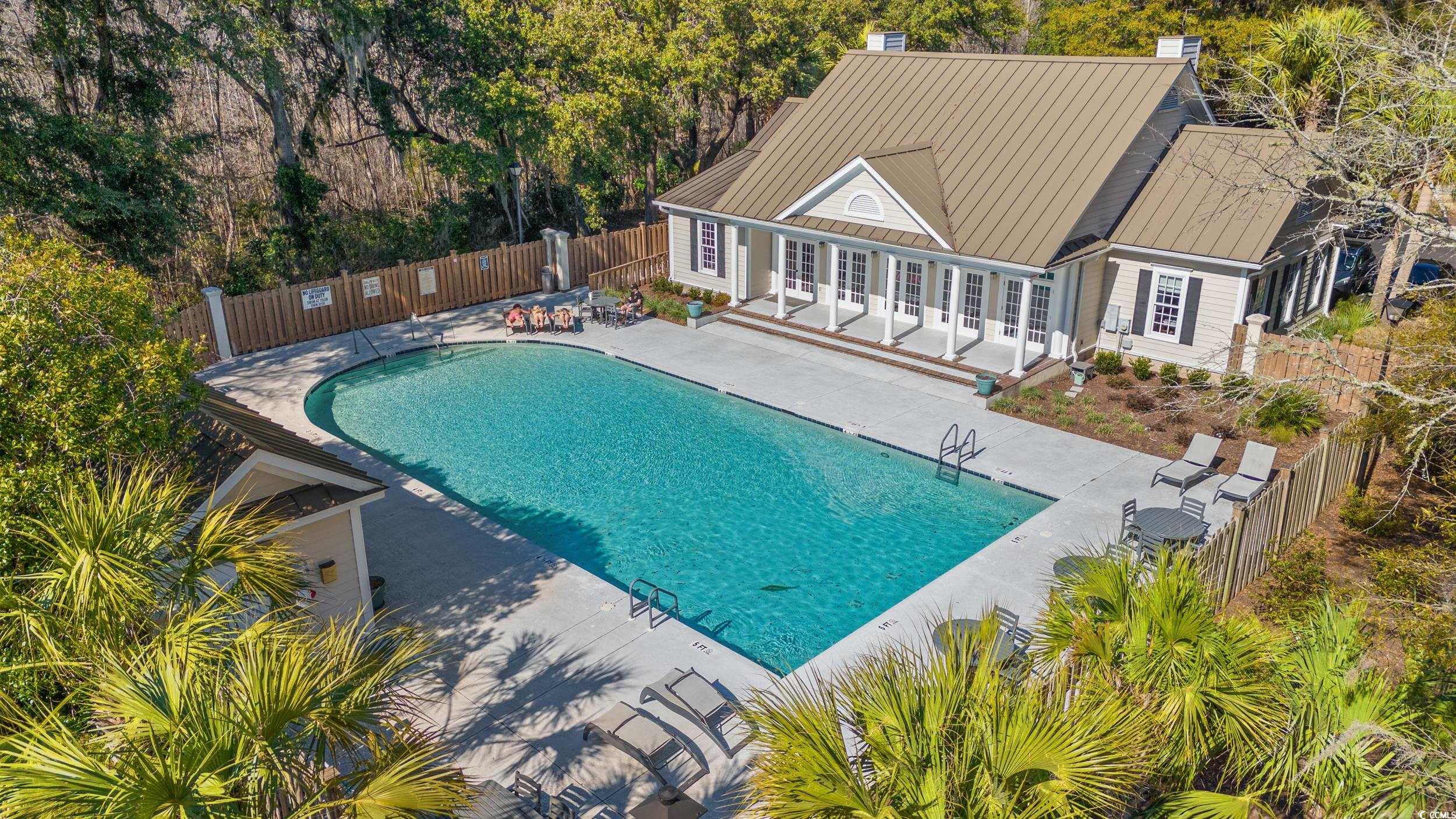 30 Baldwin Loop Pawleys Island, SC 29585 - Photo 33 of 39 Community pool with fence and a patio Club house