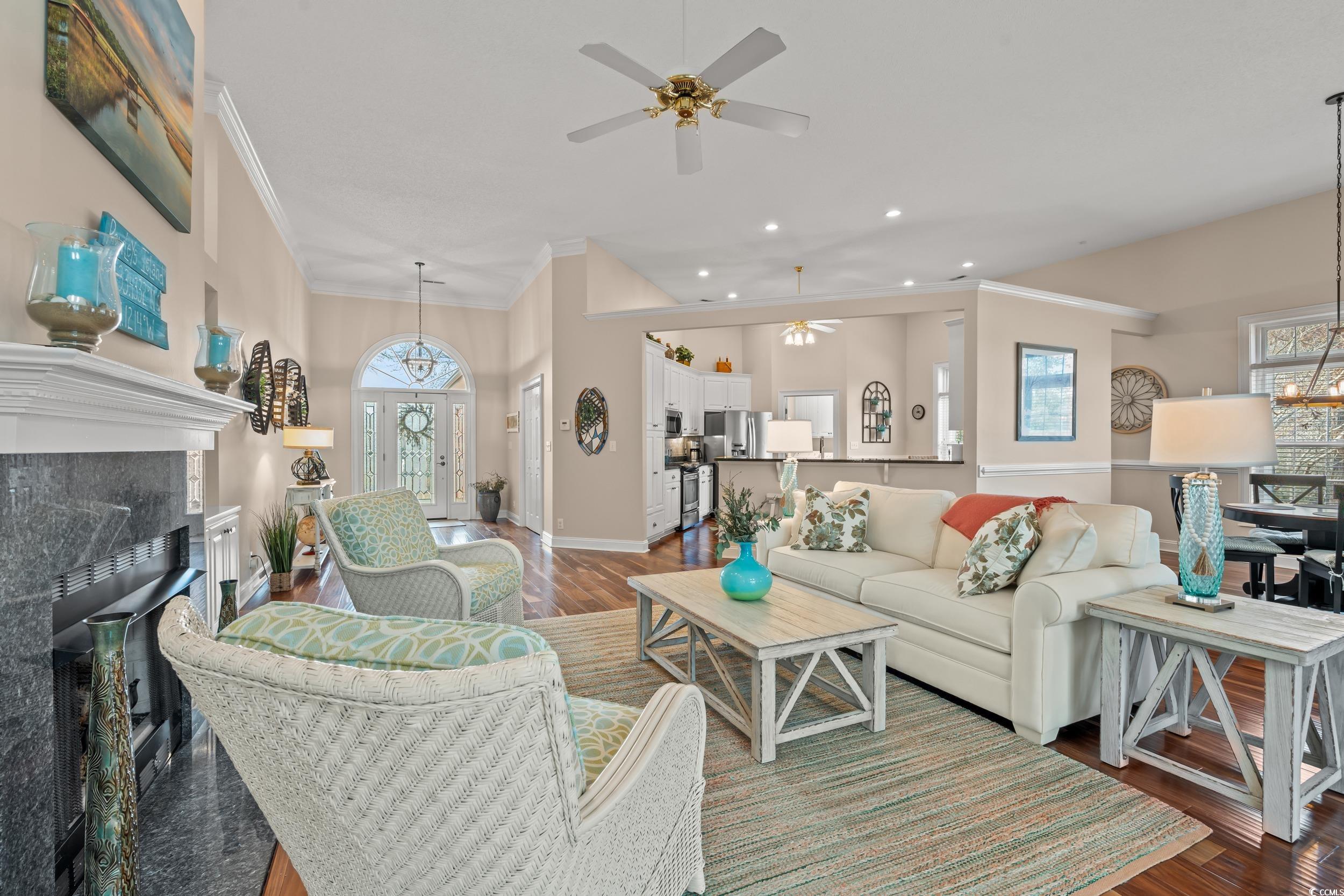 30 Baldwin Loop Pawleys Island, SC 29585 - Photo 4 of 39 Living room with baseboards, a tile fireplace, orn