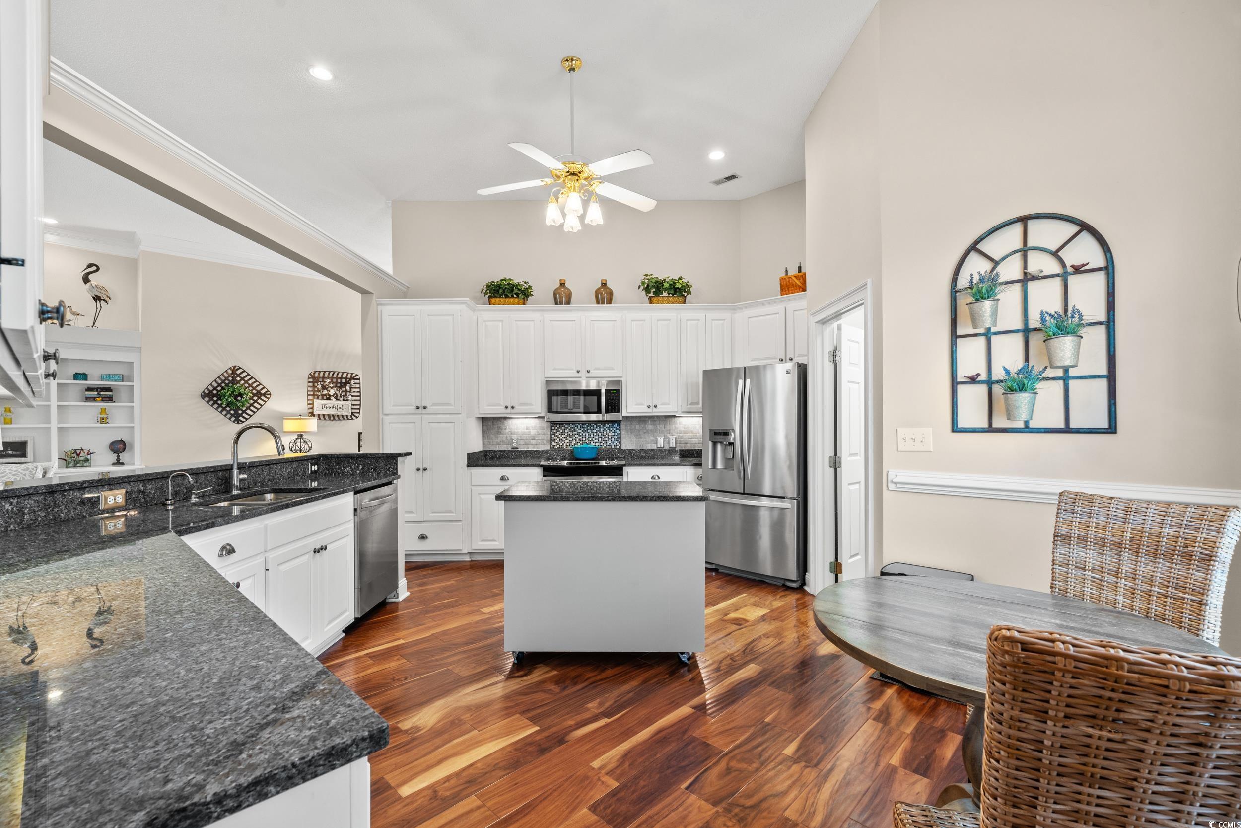 30 Baldwin Loop Pawleys Island, SC 29585 - Photo 7 of 39 Kitchen featuring a sink, white cabinets, applianc