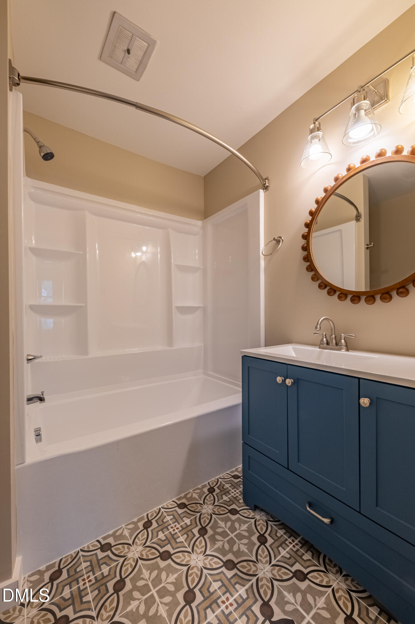 408 Ortega Road Raleigh, NC 27609 - Photo 16 of 25 a bathroom with a bathtub and a mirror