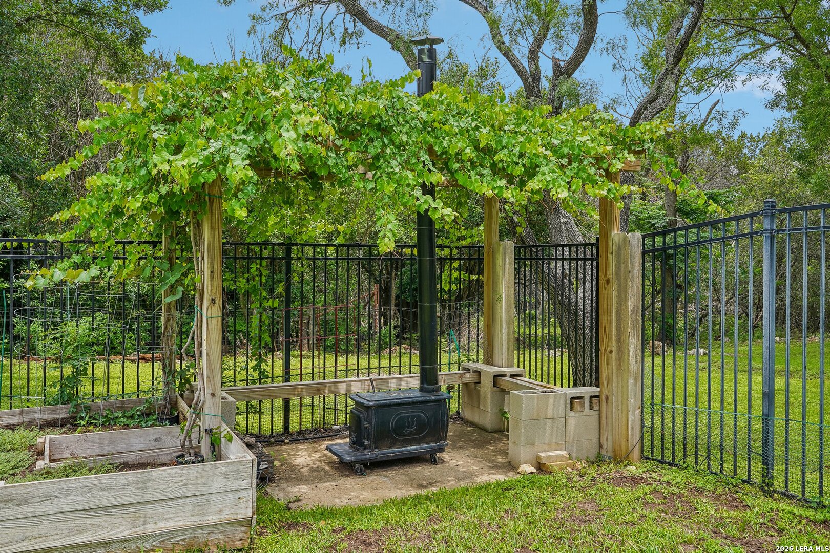 20632 Timber Rose Drive Garden Ridge, TX 78266 - Photo 40 of 46 a view of a chair and tables in the backyard