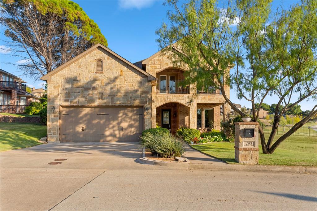 293 Harborview Drive Rockwall, TX 75032 - Photo 1 of 37 a front view of a house with garden