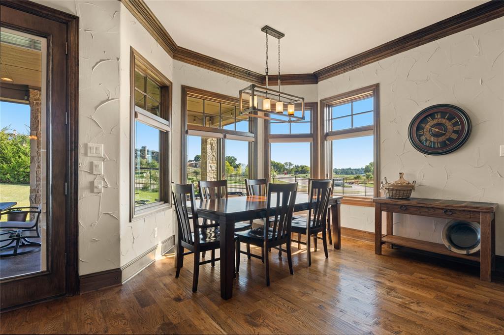 293 Harborview Drive Rockwall, TX 75032 - Photo 15 of 37 a view of a livingroom with furniture window and wooden floor