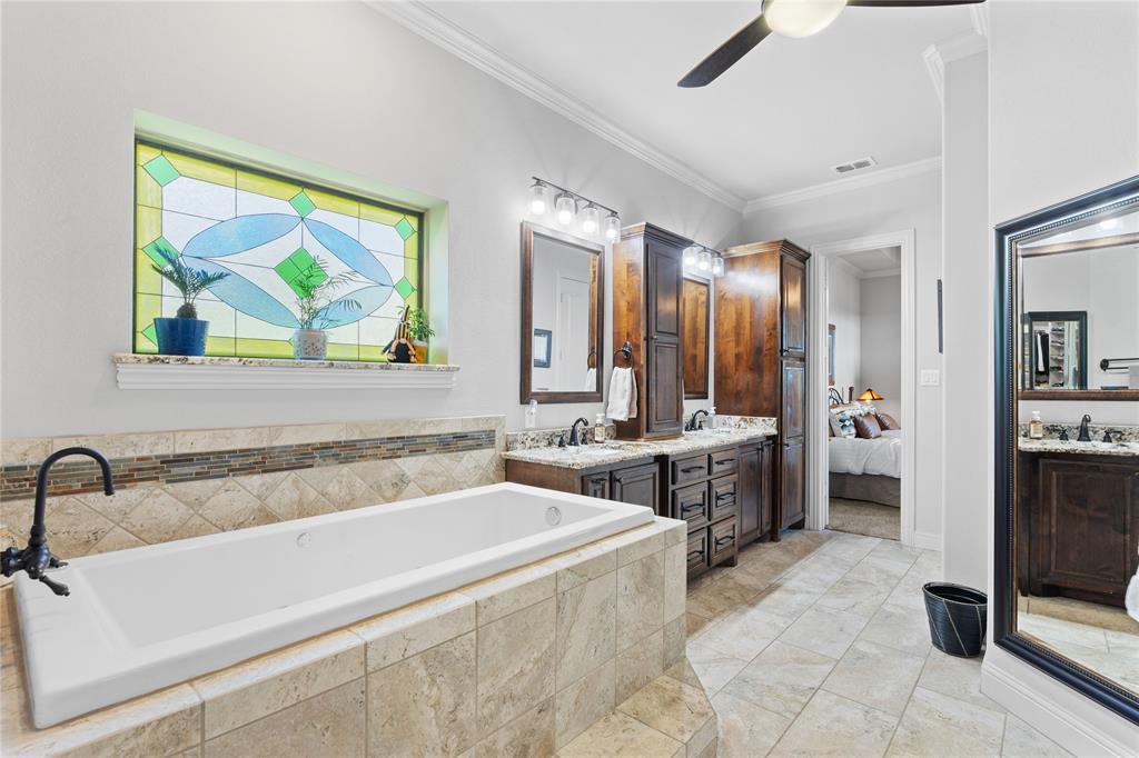 293 Harborview Drive Rockwall, TX 75032 - Photo 20 of 37 a spacious bathroom with a tub sink and mirror