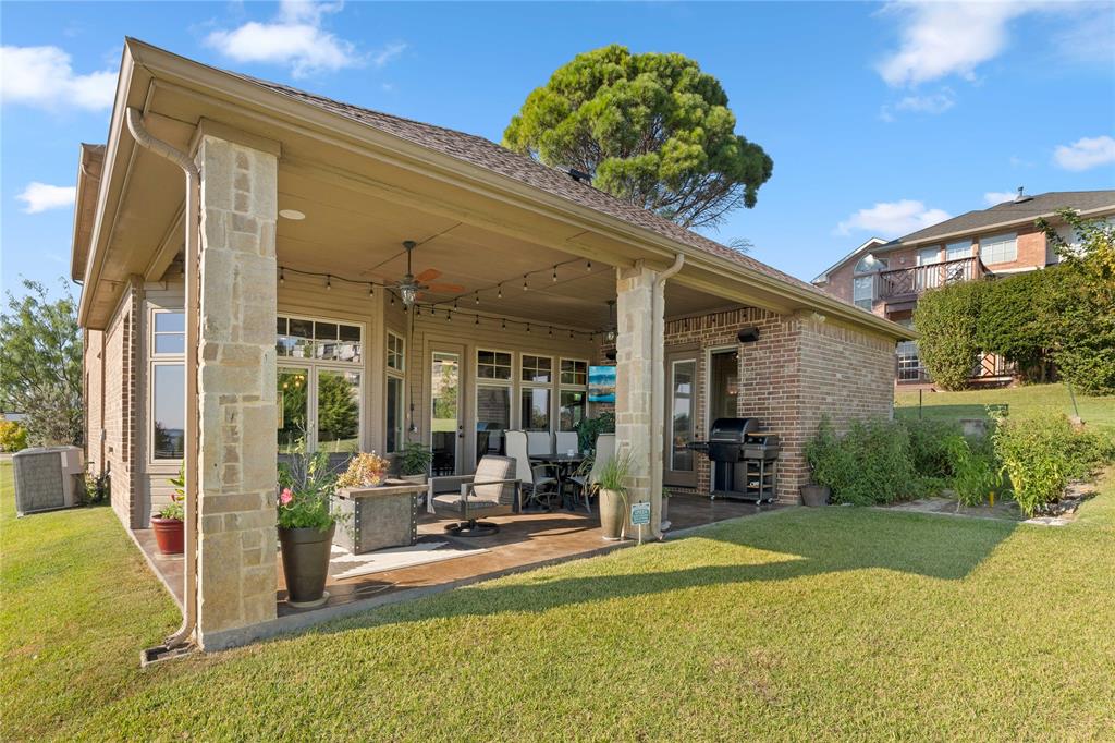 293 Harborview Drive Rockwall, TX 75032 - Photo 2 of 37 a view of a house with backyard porch and furniture