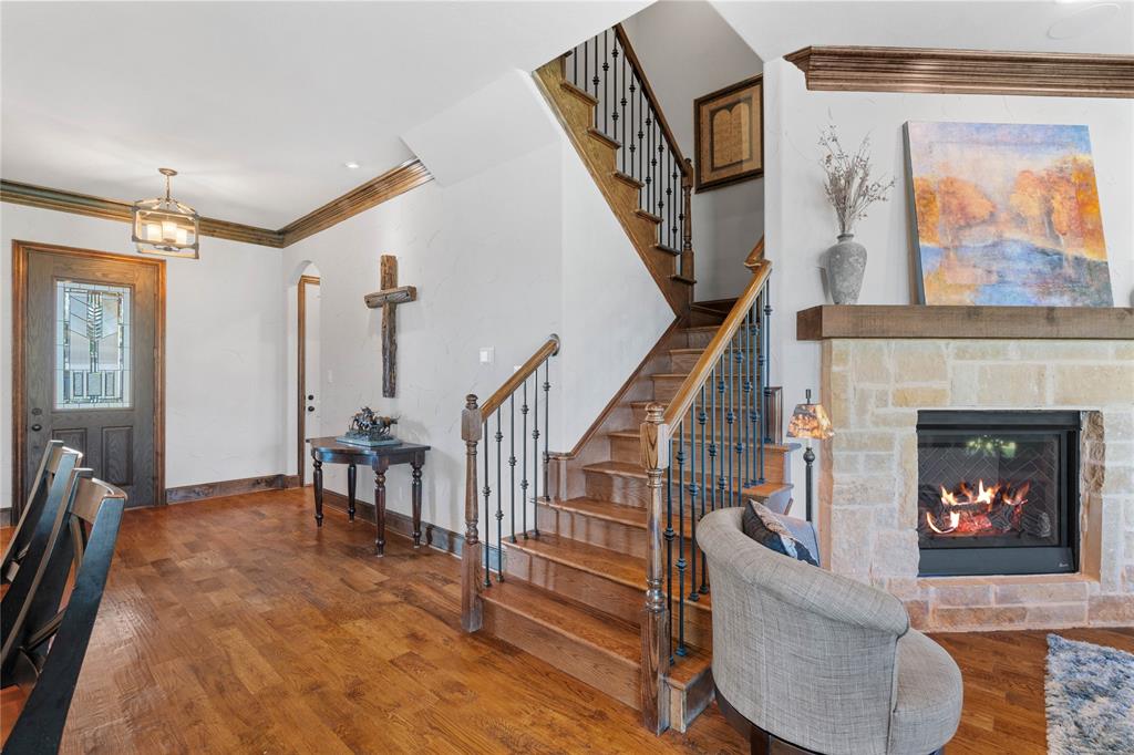 293 Harborview Drive Rockwall, TX 75032 - Photo 7 of 37 a living room with furniture and a fireplace
