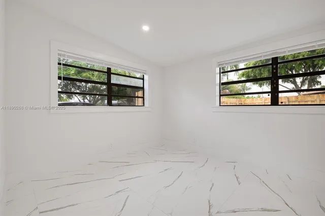 an empty room with windows