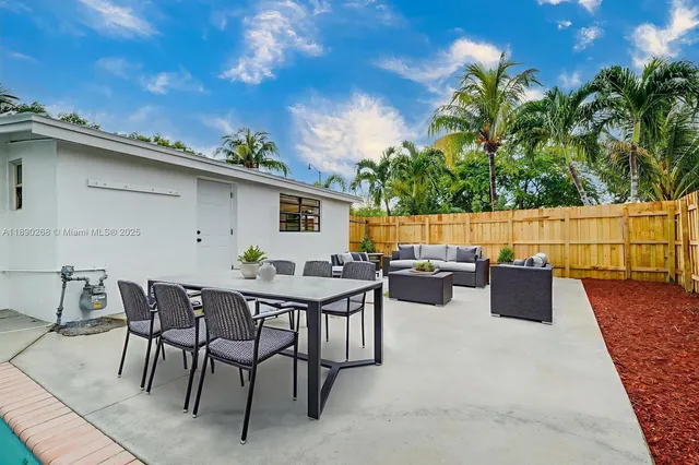 a view of an outdoor sitting area with furniture and a garden