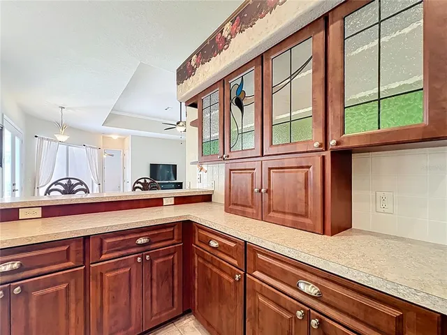 a kitchen with stainless steel appliances granite countertop a sink and a cabinets