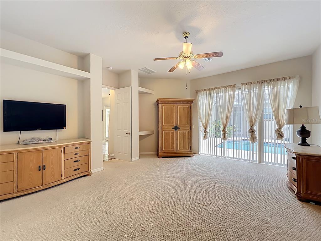 17 Sweetbay Court Homosassa, FL 34446 - Photo 26 of 61 a living room with furniture and a flat screen tv
