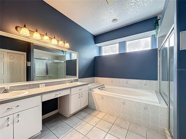 a view of an empty room with a ceiling fan