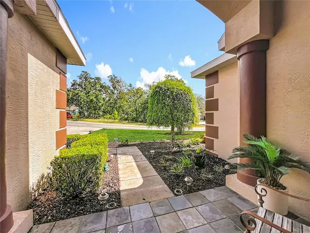 a view of a house with a backyard