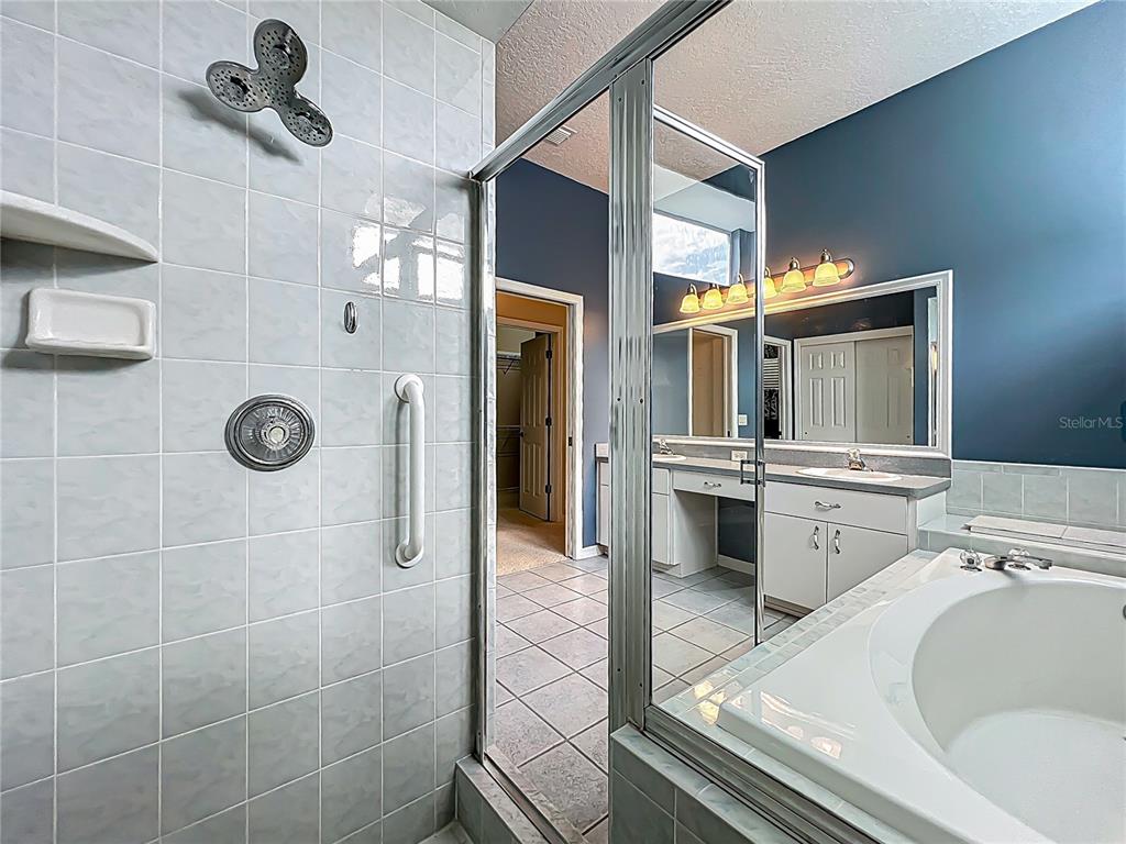 17 Sweetbay Court Homosassa, FL 34446 - Photo 31 of 61 a bathroom with a sink a mirror and shower