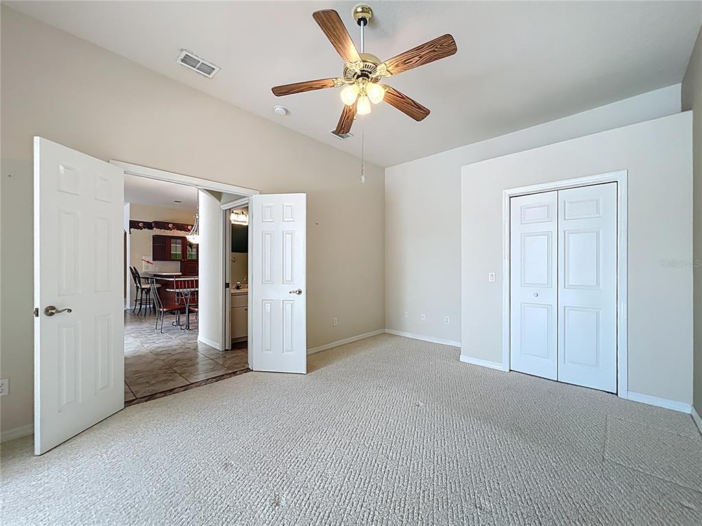 17 Sweetbay Court Homosassa, FL 34446 - Photo 33 of 61 a view of an empty room with a ceiling fan