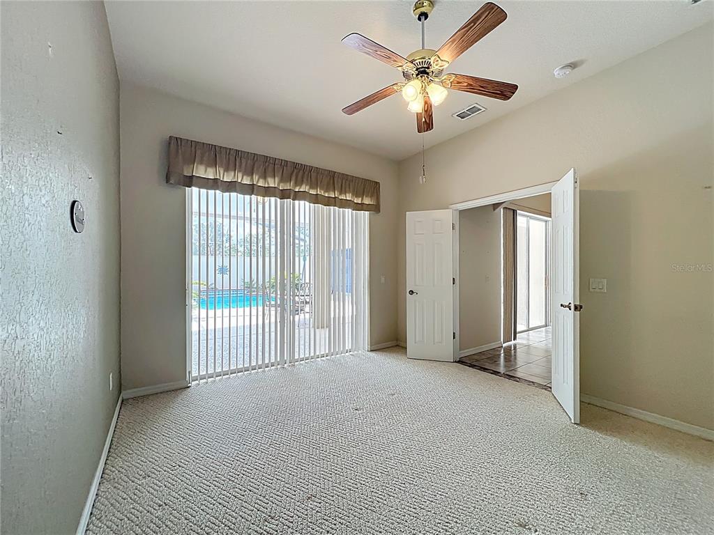17 Sweetbay Court Homosassa, FL 34446 - Photo 34 of 61 a view of a livingroom with a ceiling fan and window