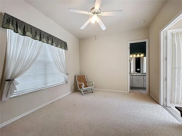 a bathroom with a window and a shower
