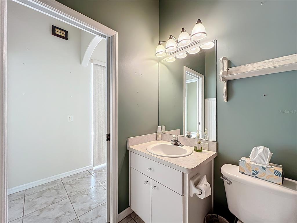 17 Sweetbay Court Homosassa, FL 34446 - Photo 36 of 61 a bathroom with a double vanity sink mirror and toilet