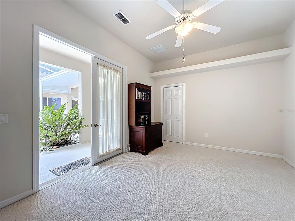 17 Sweetbay Court Homosassa, FL 34446 - Photo 39 of 61 en empty room with closet and a chandelier fan