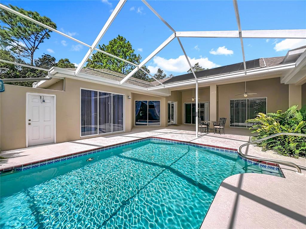 17 Sweetbay Court Homosassa, FL 34446 - Photo 48 of 61 a view of a house with porch and a garden