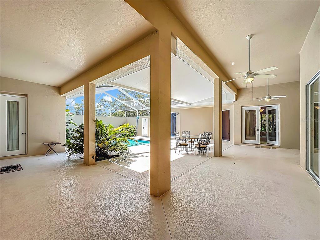 17 Sweetbay Court Homosassa, FL 34446 - Photo 5 of 61 a view of a big room with balcony furniture and floor to ceiling window