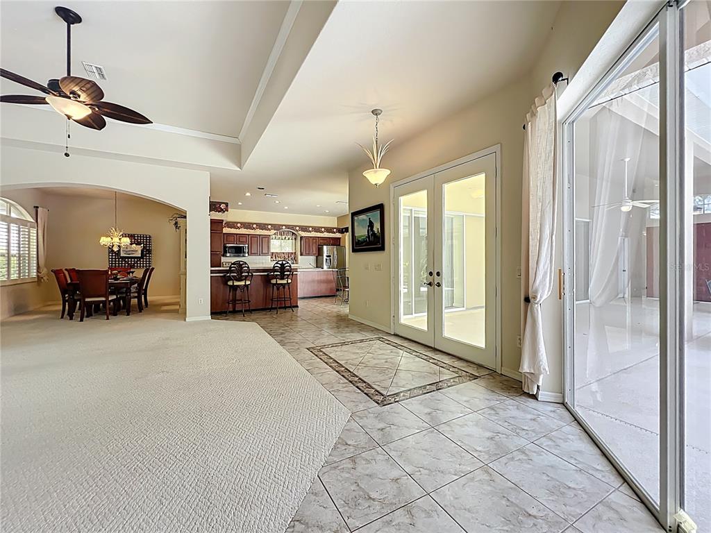 17 Sweetbay Court Homosassa, FL 34446 - Photo 8 of 61 a view of livingroom with furniture and a chandelier