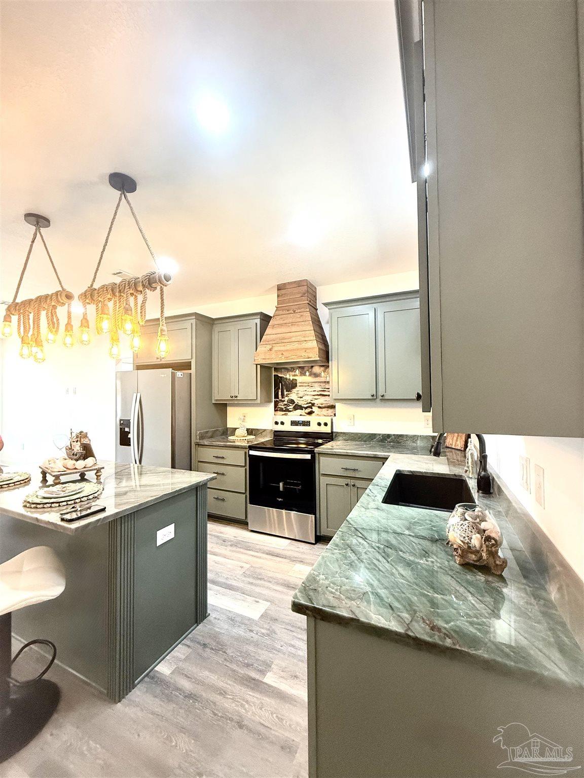 4035 Charles Circle Pace, FL 32571 - Photo 11 of 68 a kitchen with a stove and a wooden floors